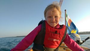 Ailís taking her turn on the helm